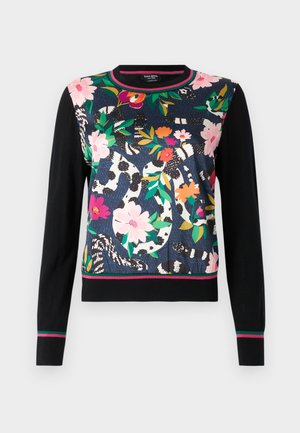 Naisten neulepaita, jossa on kukkakuosi vaaleanpunaisella, punaisella ja vihreällä tummansinisellä taustalla, mustat hihat ja raidoitettu helma.