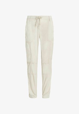 Beżowe bawełniane spodnie dresowe z regulowanym paskiem z możliwością zszycia, bocznymi kieszeniami naszytymi i ściągaczami u dołu. Szczegóły przeszycia w całej długości.