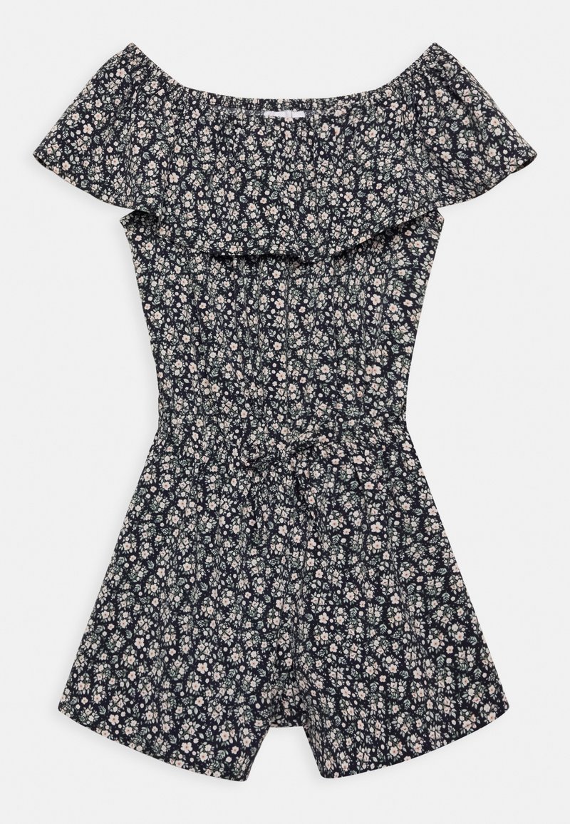 Combinaison fleurie à épaules dénudées avec encolure à volants, taille cintrée, sur fond sombre avec de petites fleurs blanches et rose pâle.