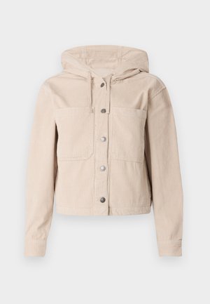 Beežist soonik, millel on kapuuts, esiküljel nupupaneel ja kaks rinnataskut. Tekstuuriga kangas ribipatterniga.