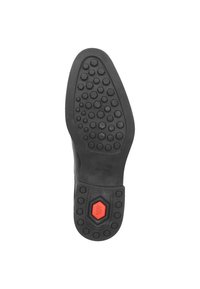 Zwarte rubberen schoenzool met hexagonaal patroon en rode "SUPER SOFT" accent. Heeft een afgeronde vorm en diepe profiel voor grip.