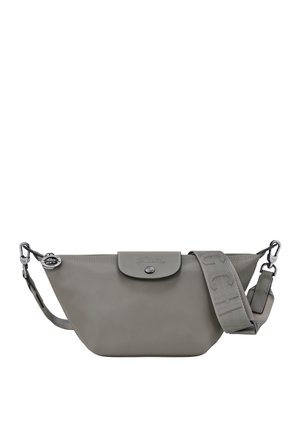 Gray leather crossbody bag with a rounded shape, snap closure, and logo detail. Features a textured strap and silver hardware accents.