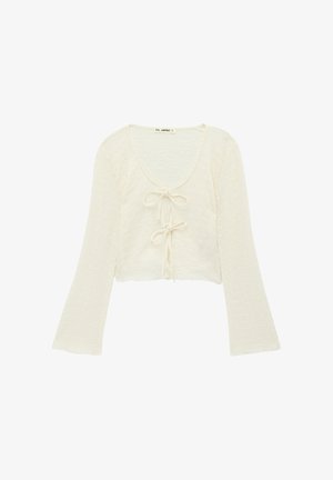 Croptop met lange mouwen in off-white, gestructureerde stof met een ronde halslijn en een centraal strikdetail, voorzien van wijde mouwen.