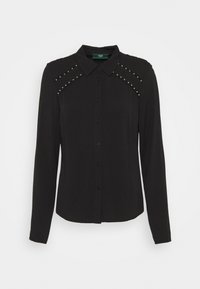 Camicia nera a maniche lunghe realizzata in tessuto morbido. Presenta un colletto classico e borchie lungo le cuciture delle spalle. Chiusura frontale con bottoni.