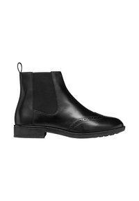Botín negro de cuero con paneles laterales elásticos, detalles de brogue en la puntera y suela de goma plana con un ligero tacón.