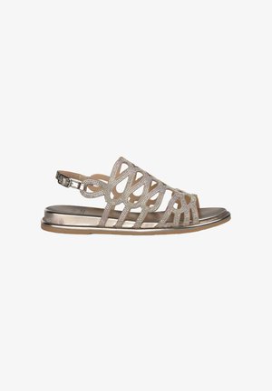 Metallic gold sandal with decorative cut-out design, embellished with rhinestones. Flat sole with adjustable ankle strap and smooth texture.
