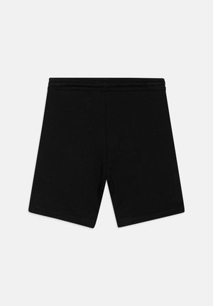 Mustad mustadest püksid elastse vöökohtaga. Sile tekstuur, lihtne disain, põlvekohale ulatuv lõige, ei mingeid nähtavaid mustreid ega aktsente.