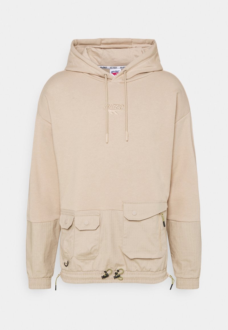 Sweat-shirt à capuche beige avec un panneau inférieur texturé, des poches avant, un ourlet ajustable avec cordon de serrage et un logo brodé sur la poitrine.