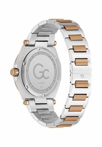 Sølv rustfrit stål ur med oktagonal kasse, børstet metalfinish, rosaguld detaljer på remmen og safirglas. Swiss movement.