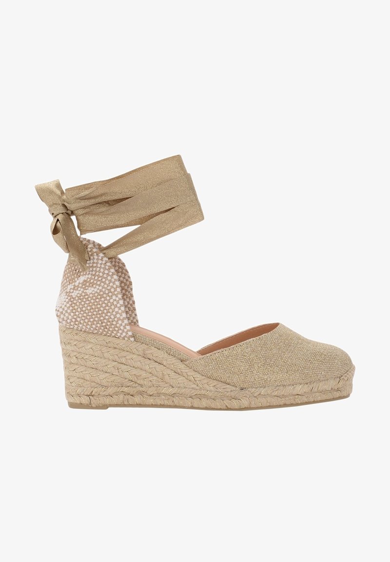 Chaussure espadrille compensée beige avec plateforme en jute tressée et liens à nouer à la cheville en tissu beige assorti.