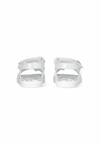 White sandals with adjustable straps, featuring a textured gray patterned insole and a smooth, glossy exterior. Suitable for casual wear.