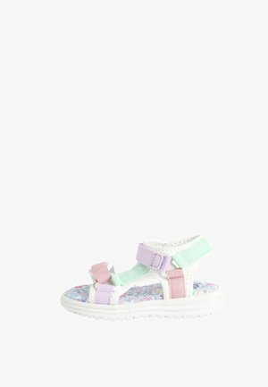 Otroške sandale z belim podplatom, roza, mentolno in sivkasto-lavandalnimi trakovi. Imajo cvetlični motiv na podplatu in nastavljive Velcro zaponke.