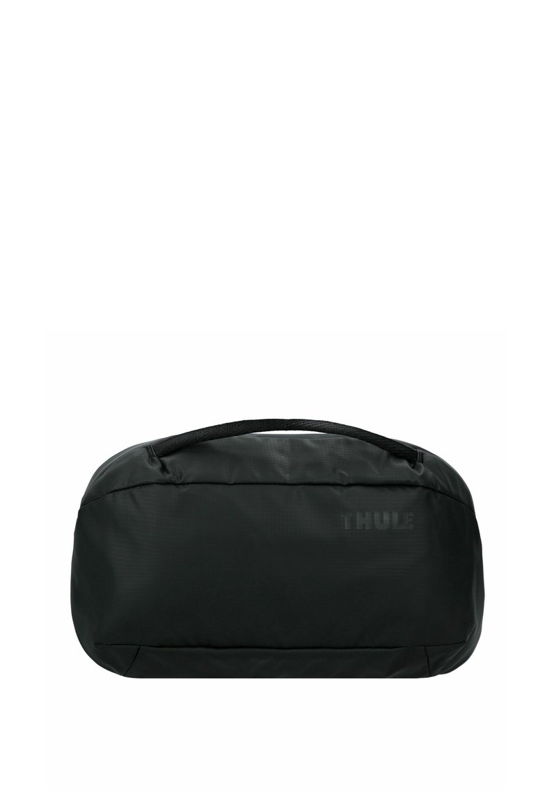 Borsa da viaggio nera con una forma aerodinamica, realizzata in tessuto resistente. Presenta una superficie testurizzata e una maniglia superiore per un facile trasporto.