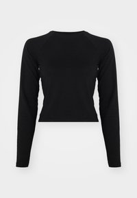 Svart langermet crop-top med rund hals og raglanerm. Glatt tekstur, minimalisk design, og ingen synlige mønstre eller maskinvare.