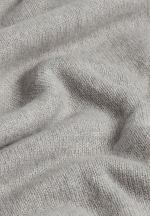 Light gray knitted fabric with a soft texture, displaying a loose, draped appearance and subtle variations in color throughout.