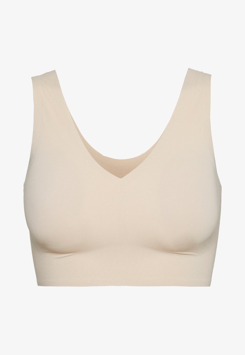 Bralette beige con un amplio escote redondeado, diseño sin costuras y tejido suave y elástico para mayor comodidad. Sin herrajes ni cierres visibles.