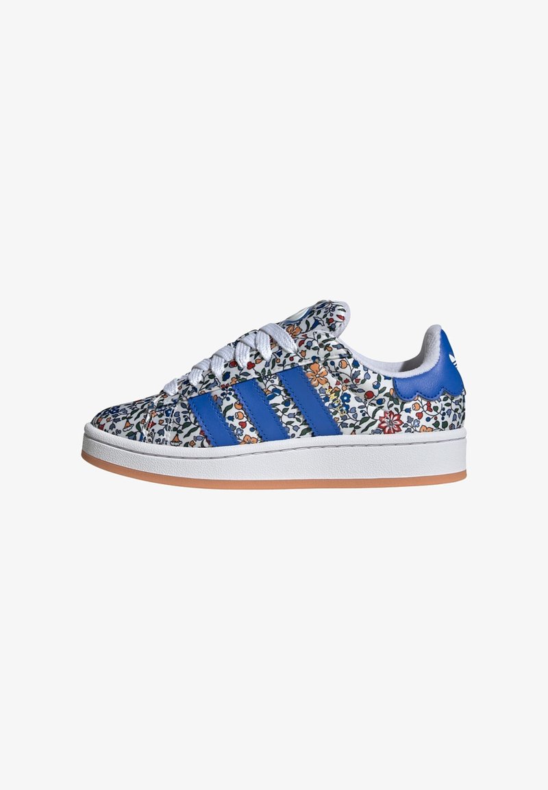White sneakers with a floral pattern, blue stripes, and a gum sole. Features a padded collar and lace-up front with white laces.