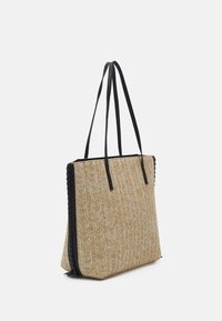 Beige woven tote bag with black synthetic handles, featuring a textured surface and contrasting black edging.