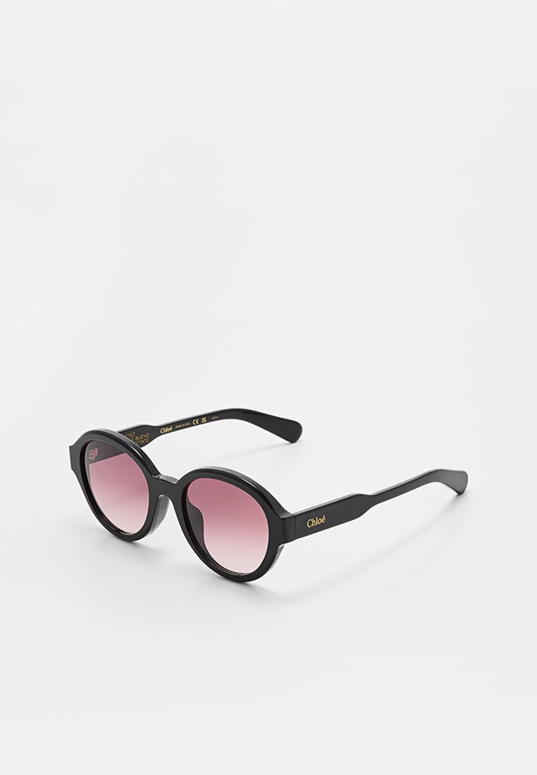 Schwarze runde Sonnenbrillen mit rosa Verlaufslinsen und Chloé-Logo auf den Bügeln, gezeigt auf einem weißen Hintergrund.