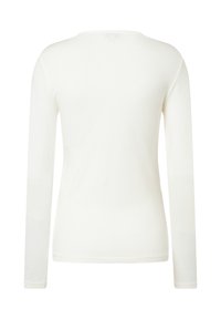Langarmshirt in hellbeige, aus weichem Stoff gefertigt. Mit einem runden Ausschnitt und einem schlichten Design ohne sichtbare Muster oder Akzente.