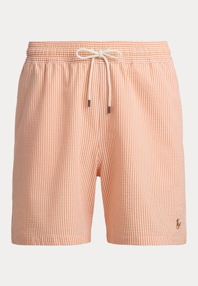 Πορτοκαλί και λευκό ριγέ μαγιό βερμούδα με ελαστική μέση, κορδόνι για σφίξιμο και μικρό κεντημένο λογότυπο στο κάτω αριστερό μέρος.