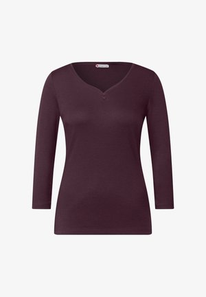 Burgunderfarbenes Langarmoberteil mit V-Ausschnitt, das zwei Knöpfe am Ausschnitt hat. Hergestellt aus einem weichen Stoff mit glatter Textur und taillierter Passform.