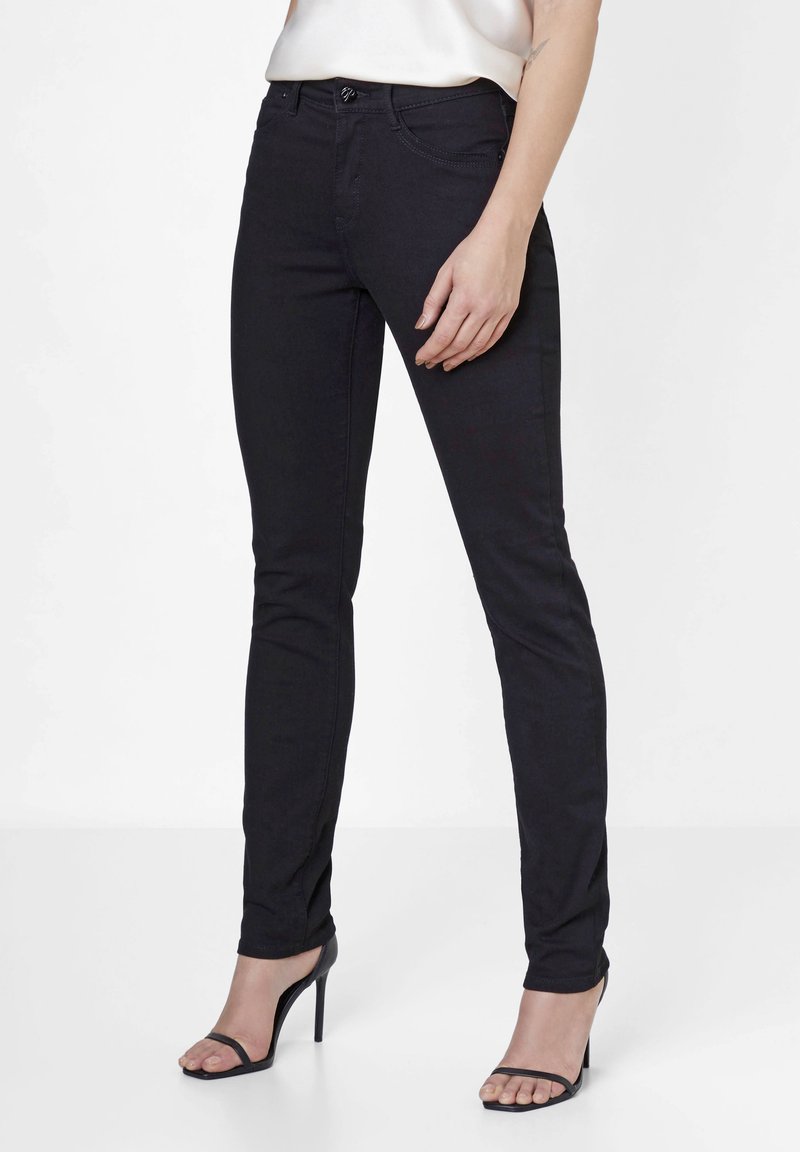 Schwarze Skinny-Jeans aus Denim, mit einem enganliegenden Design, glatter Textur und traditionellem Fünf-Taschen-Style.