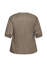Blusa marrón de manga corta y escote redondeado, con una textura suave y adornada con pequeños lentejuelas dispersas como detalle.
