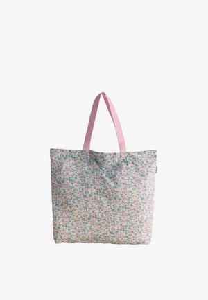 Borsa tote riutilizzabile con piccolo motivo floreale rosa e verde e manici rosa solidi su sfondo bianco.
