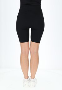 Swedemount RIBBED SEAMLESS SHORT TIGHTS - Shorts - black