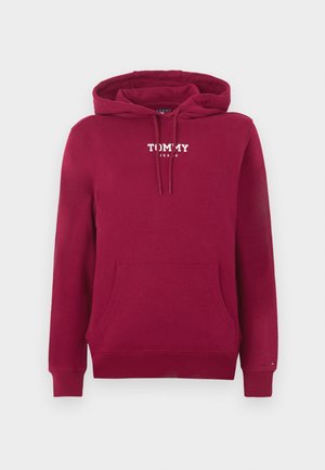 Punane kapuutsiga dressipluus, valmistatud puuvillast, ees tasku ja nööritav kapuuts, rinnal valge tekst "TOMMY JEANS".