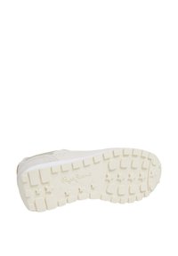 White sneaker with textured leather upper, rubber sole featuring star patterns and raised treads, and embossed logo on the heel.