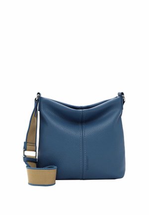 Blå læder crossbody taske med bred beige justerbar rem og synlig syning ned langs midten, vist mod en hvid baggrund.