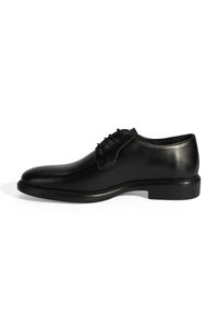 Schwarze Leder dress Schuhe mit runder Zehenform, glatter Oberfläche, Schnürdesign und einer niedrigen, strapazierfähigen Gummisohle.