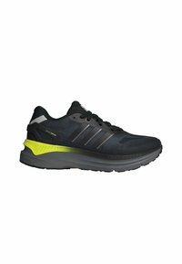 Black and gray running shoe with neon yellow accents, three gray stripes on the side, and black laces.