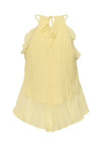 Combinaison jaune sans manches avec lien autour du cou, emmanchures volantées et tissu plissé.