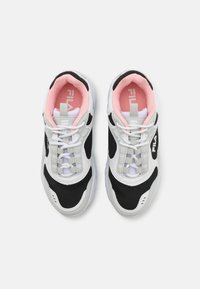 Black and white mesh sneakers with light pink accents. Features include a cushioned collar, flat white laces, and a logo on the side.