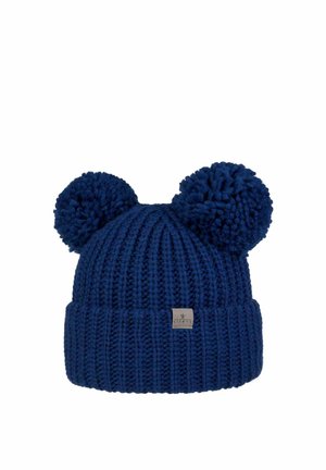 Navy blue knitted beanie with two large pom-poms resembling ears and a small fabric brand label on the folded cuff.