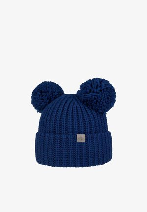 Navy blue knitted beanie with two large pom-poms resembling ears and a small fabric brand label on the folded cuff.