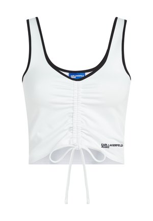 Top corto sin mangas blanco con ribete negro, fruncido en la parte delantera con lazo ajustable y logotipo "Karl Lagerfeld Jeans" en la parte inferior derecha.