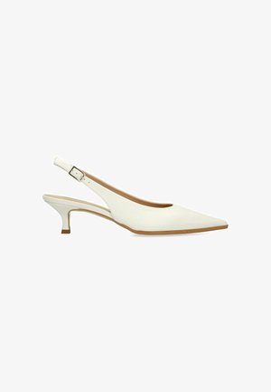 White leather slingback kitten heel shoe with pointed toe and adjustable buckle strap.