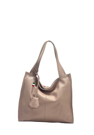 Beige leather handbag with double straps, a hexagonal leather tag, and a small red, green, and white striped charm hanging near the handle.