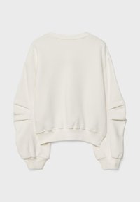 Sweatshirt long à manches longues écru uni avec des poignets et un ourlet côtelés, légèrement court avec une coupe décontractée et surdimensionnée, vu de dos.