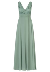 Lange, vloeiende jurk van zachte groene stof. Kant bodice met v-hals, brede banden en een geplooide taille. Glad rokje dat tot de vloer valt.