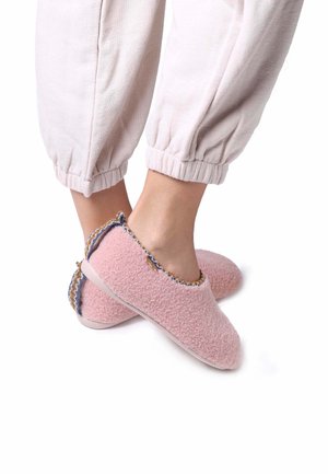 Pink fleece slippers with a rounded toe, textured surface, and a contrasting blue and gold patterned trim along the opening and heel.