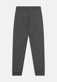 Mørkegrå joggebukser laget av myk stoff, med en tettsittende ankelmansjett og elastisk midje, designet for komfort og bevegelsesfrihet.
