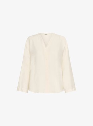 Krēmkrāsas lina krekls ar V veida kakla izgriezumu, garām piedurknēm un pogu aizdari priekšpusē. Mīksts, teksturēts audums. Vienkāršs dizains.