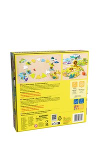 Boîte de puzzle avec des pièces de puzzle circulaires colorées sur le thème des animaux, un emballage jaune vif et des instructions de jeu en plusieurs langues.