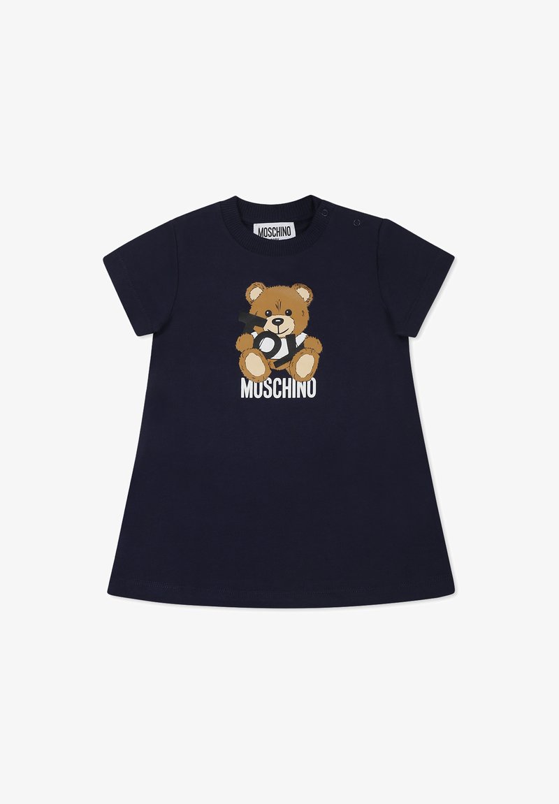 Vestito a maniche corte blu navy in cotone, con una grafica di un orso stampata e il logo "Moschino" sul davanti. Chiusura a bottoni a pressione sulla spalla.