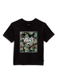 Camiseta de algodón negra con un patrón floral en tonos verdes y beige, con el logotipo de "VANS" centrado en un fondo rectangular blanco.